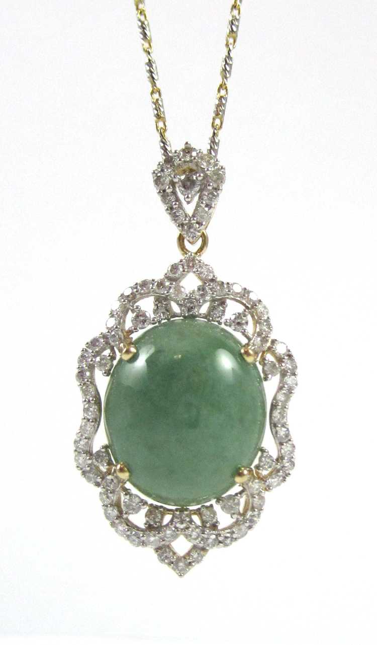 Appraisal: JADEITE JADE AND DIAMOND PENDANT NECKLACE with an inch k