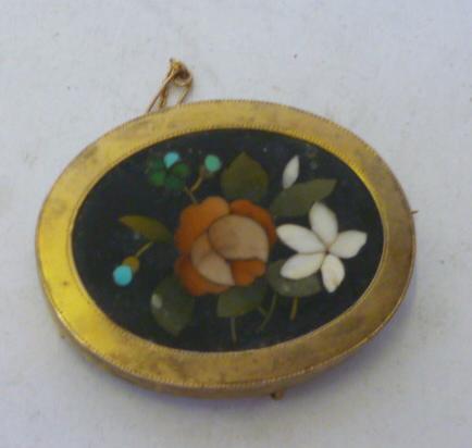 Appraisal: A PIETRA DURA BROOCH the oval panel inlaid with flowers