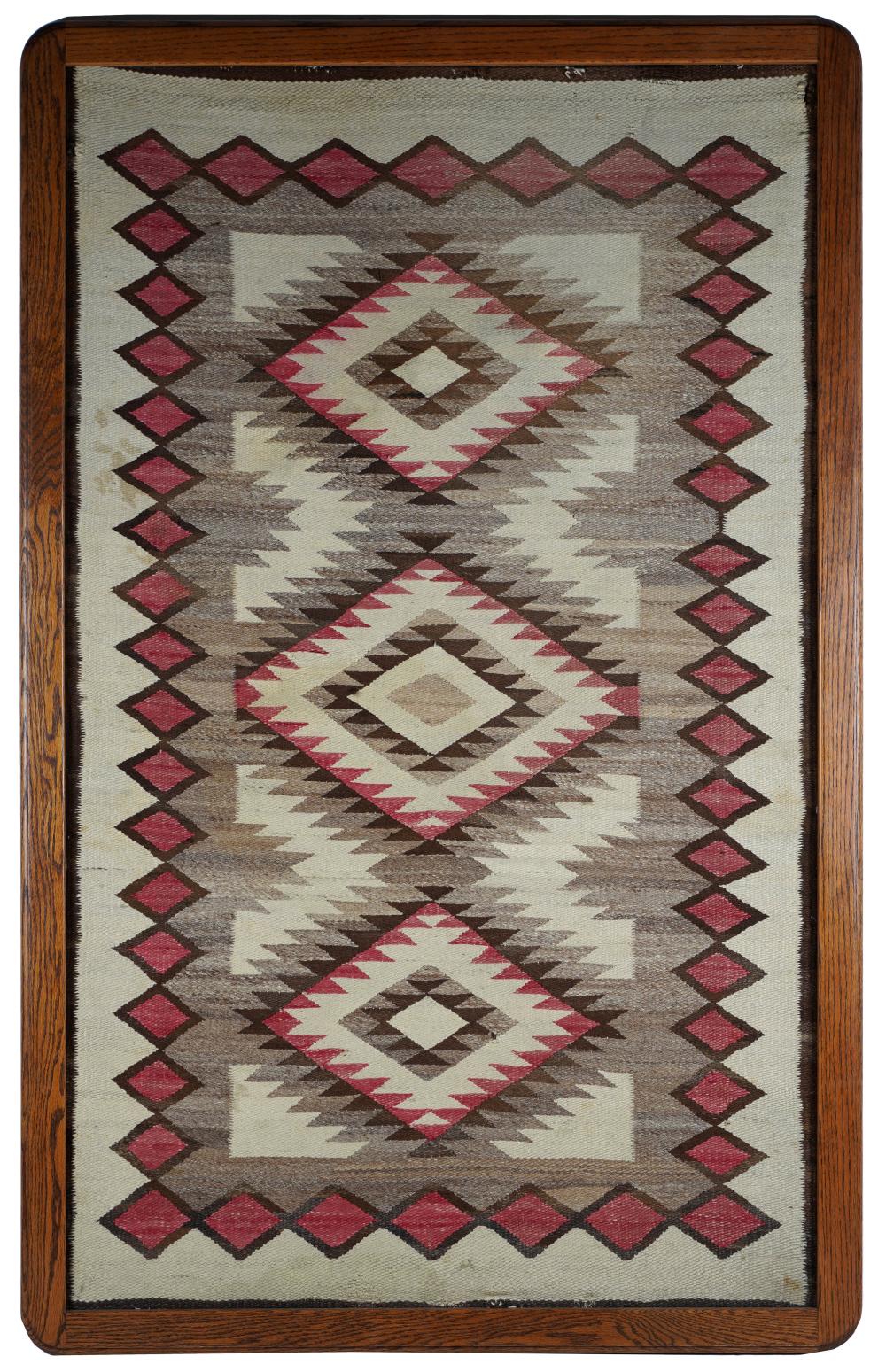 Appraisal: NAVAJO WOOL RUGmounted and framed Condition with wear x inches