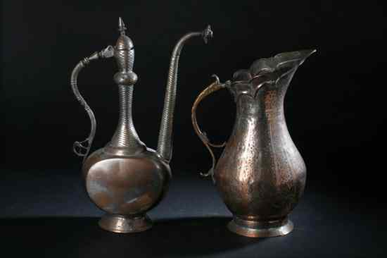 Appraisal: TWO ISLAMIC TINNED-COPPER EWERS Chased decoration - Largest in high