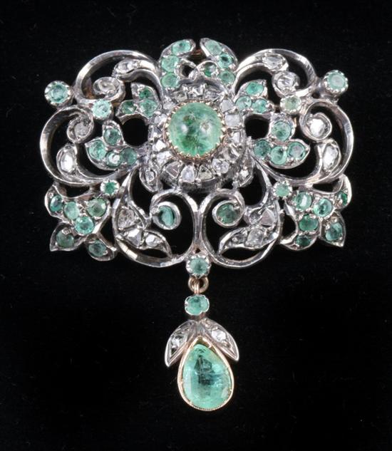 Appraisal: YELLOW GOLD SILVER DIAMOND AND EMERALD PENDANT BROOCH Early-to-mid th