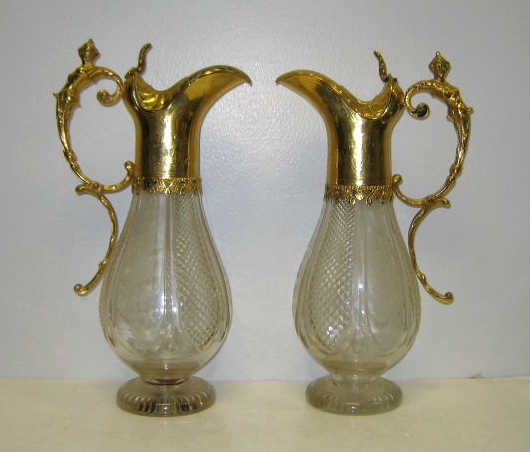 Appraisal: PAIR OF ANTIQUE GLASS AND GILT METAL CLARET JUGS Each