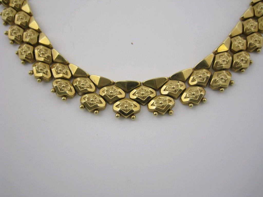 Appraisal: A Continental Gold Necklace with three rows of flexible links