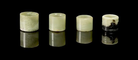 Appraisal: A Group of Four Jade Archer's Rings Diameter of widest