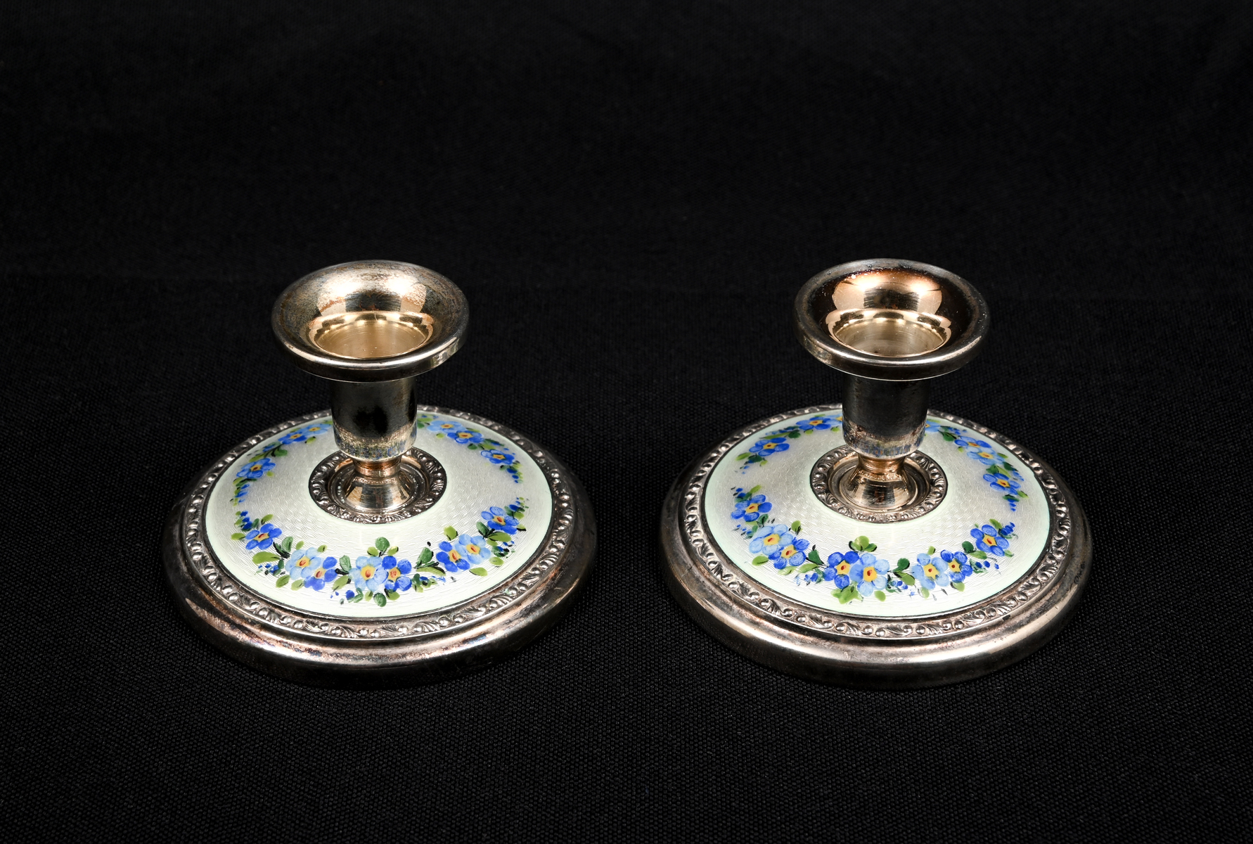 Appraisal: TH CENTURY STERLING GUILLOCHE CANDLESTICKS Pair of Sterling Silver and