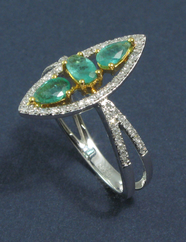 Appraisal: EMERALD AND DIAMOND RING k white and yellow gold set