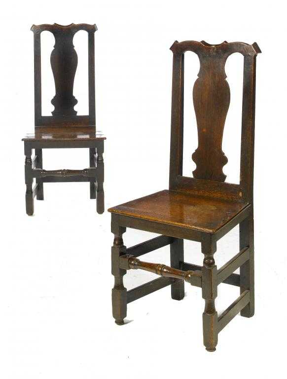 Appraisal: A PAIR OF GEORGE II OAK CHAIRS with baluster splat