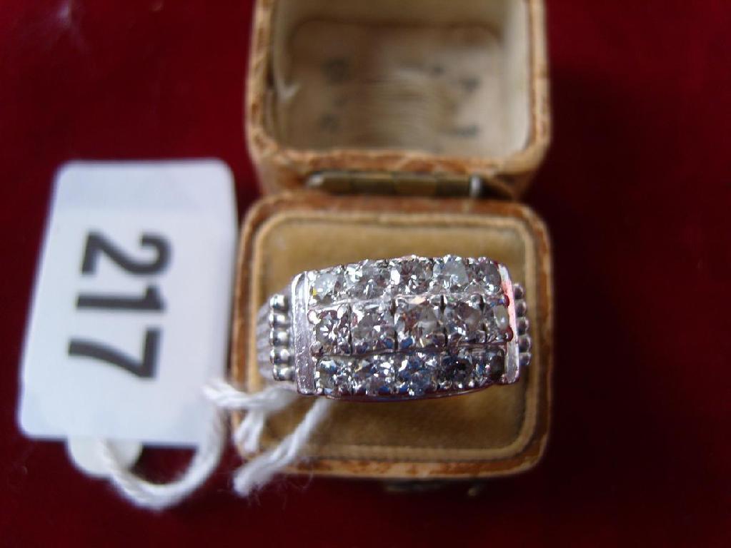 Appraisal: A diamond -row cluster ring containing brilliant cut diamonds -