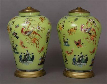 Appraisal: PAIR OF REVERSE PAINTED ON GLASS VASES MOUNTED AS LAMPS