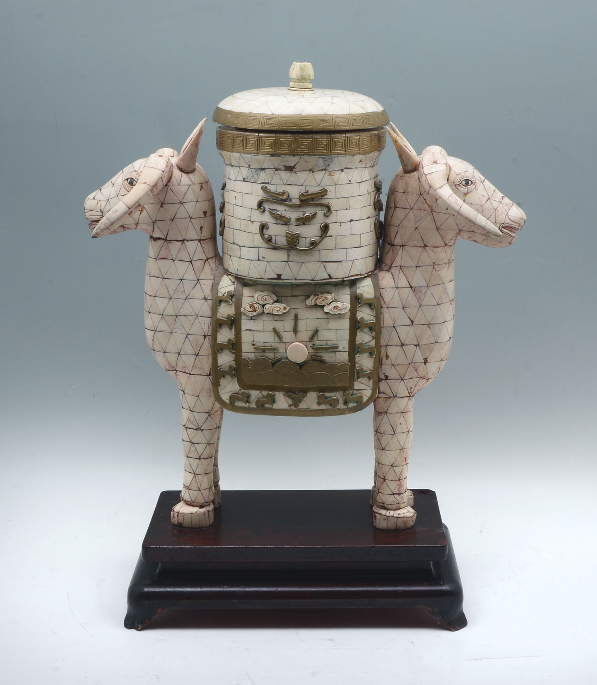 Appraisal: CHINESE BONE DOUBLE RAMS HEAD CONTAINER Chinese bone clad urn