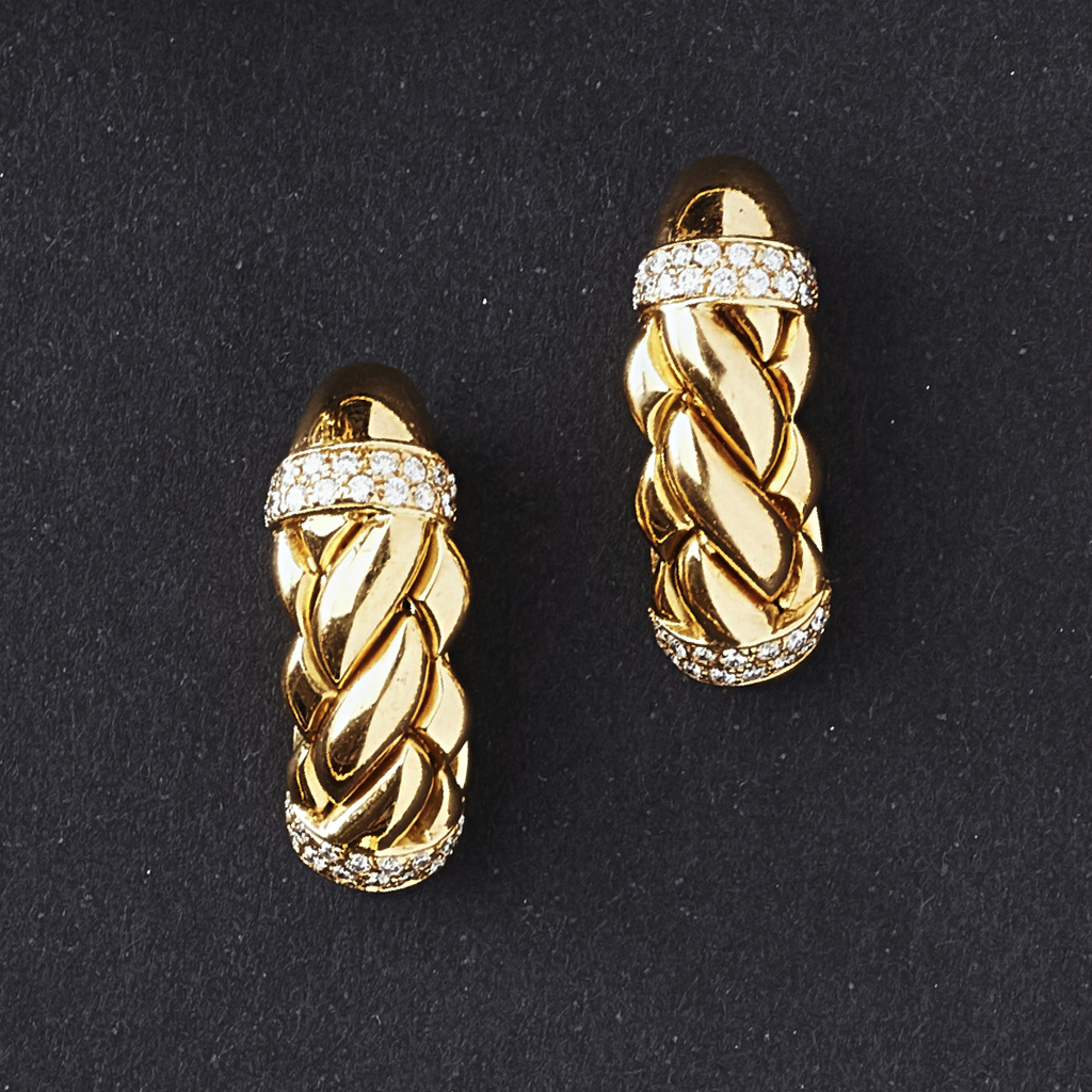 Appraisal: A pair of diamond set earrings each of curved interlocking