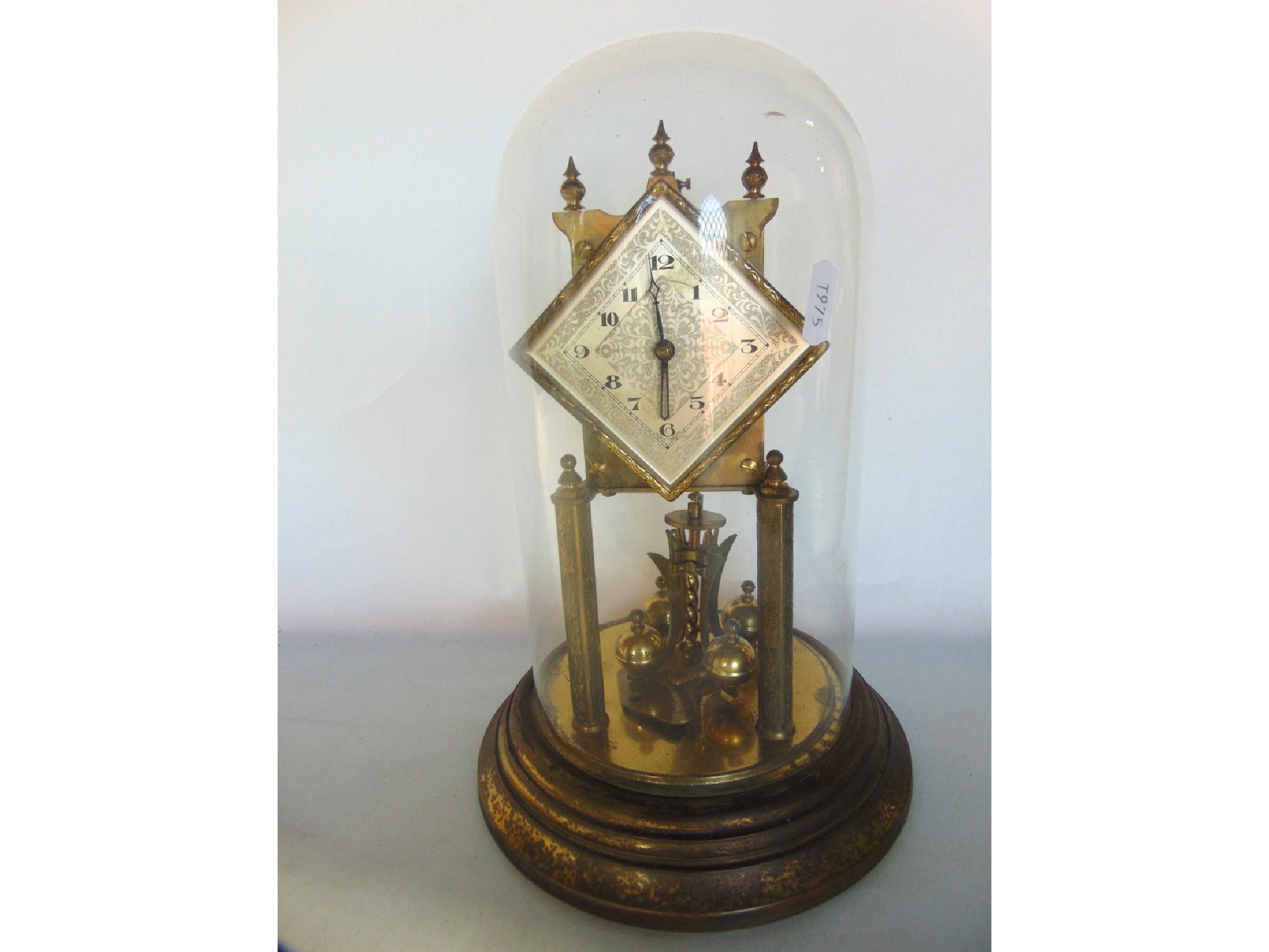 Appraisal: A brass day Anniversary clock with lozenge shaped dial set