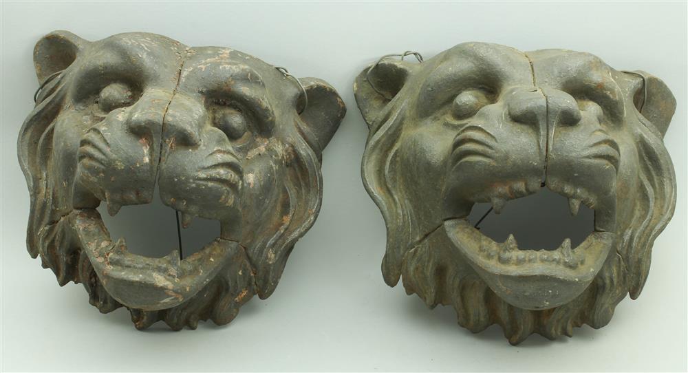 Appraisal: PAIR OF CAST IRON LION HEAD ARCHITECTURAL ELEMENTS third quarter