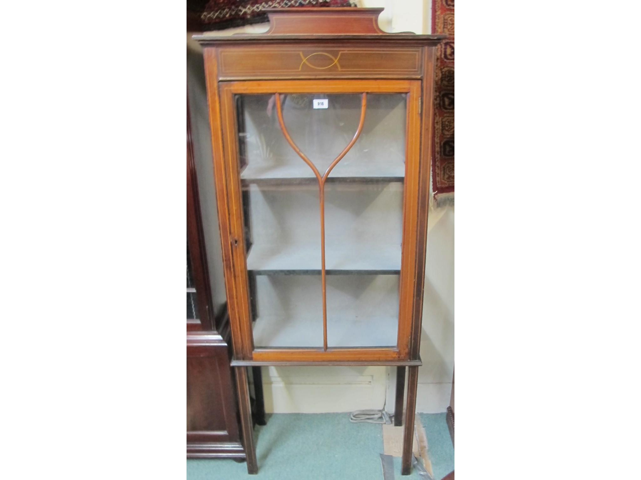 Appraisal: An Edwardian inlaid glazed display cabinet