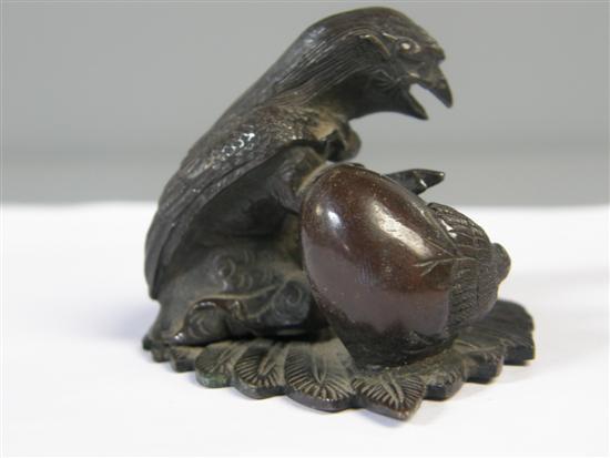 Appraisal: th century Japanese bronze figure of a bird standing on