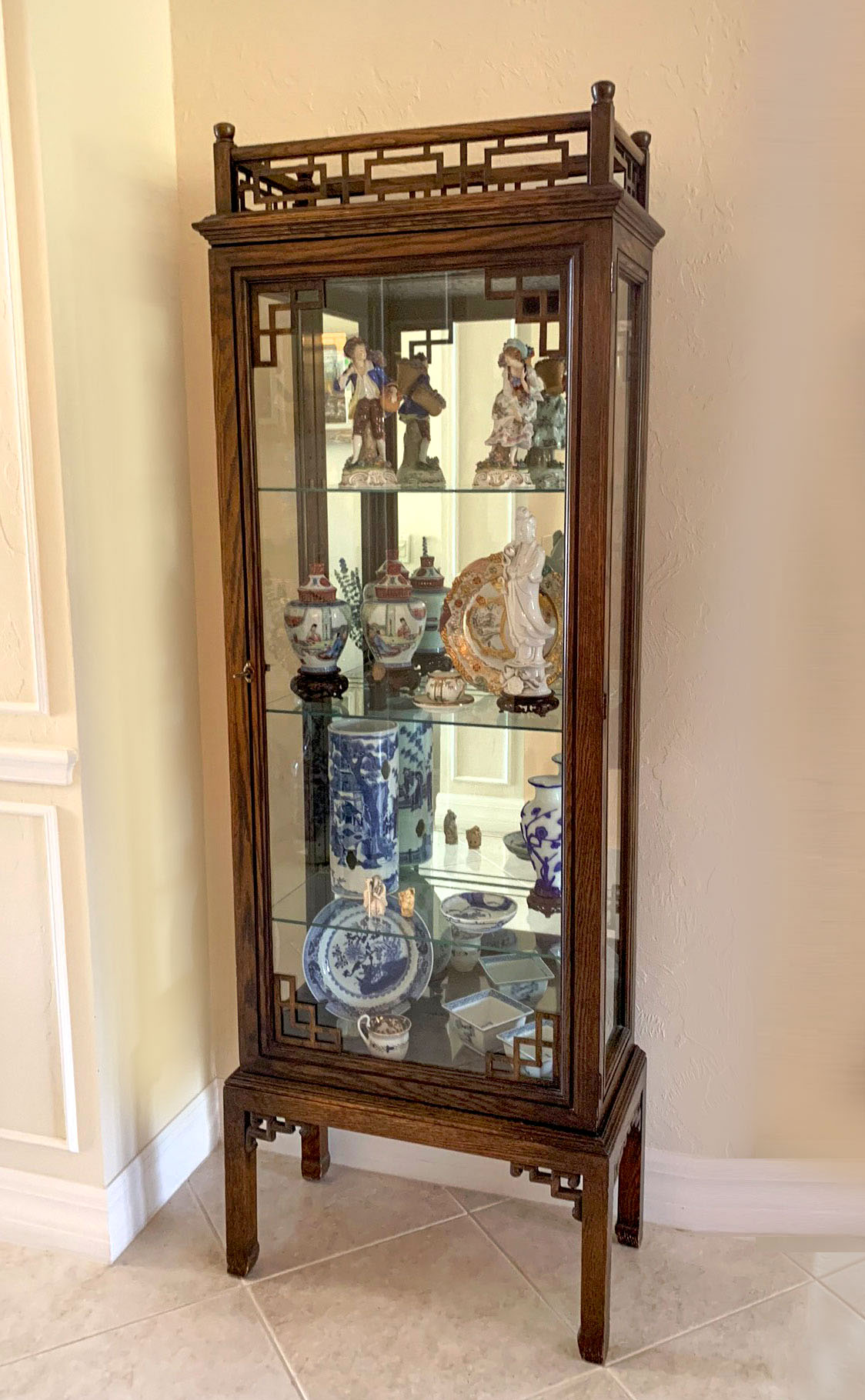 Appraisal: CHINESE MIRRORED BACK DISPLAY CABINET Chinese shelf lighted display cabinet