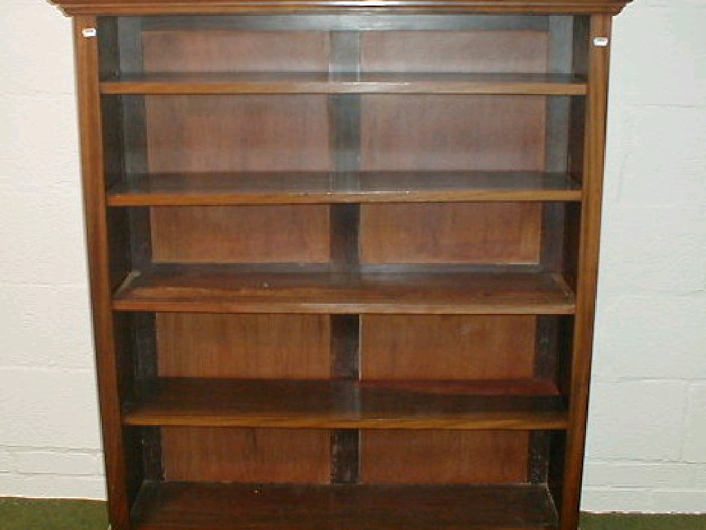 Appraisal: An Edwardian open bookcase with moulded cornice and adjustable shelves