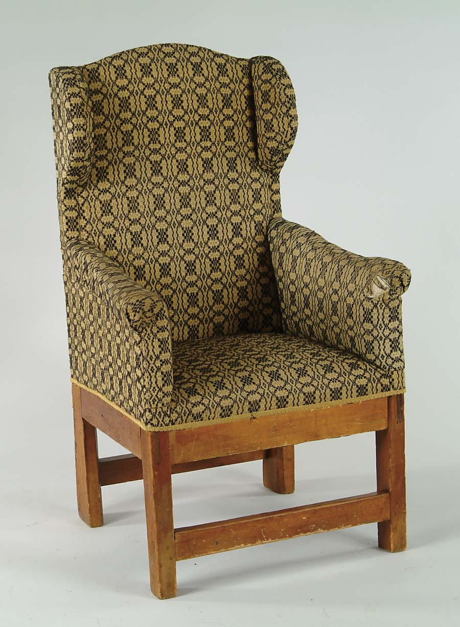 Appraisal: EARLY CANADIAN UPHOLSTERED WING CHAIR Country design with square legs