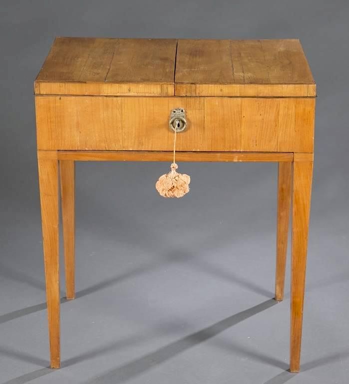 Appraisal: Neoclassical style cellarette A Neoclassical style maple veneer sewing table