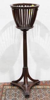 Appraisal: Regency style jardiniere on stand having a reticulated basket form