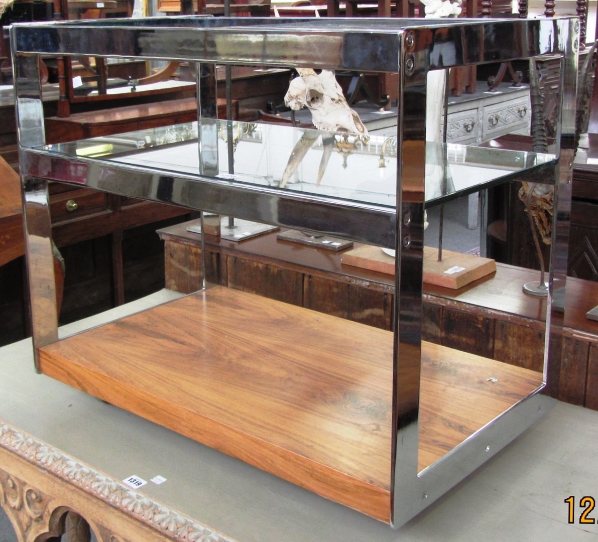 Appraisal: A th century chrome glass and hardwood three tier drinks