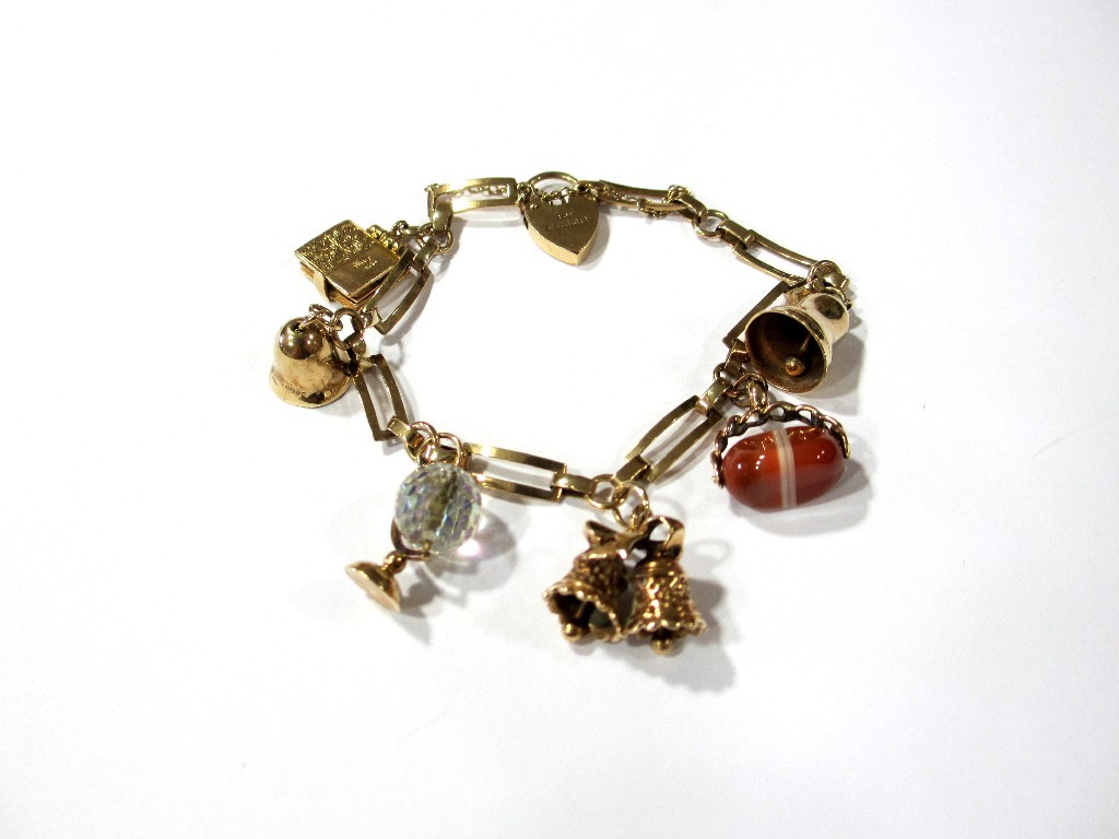 Appraisal: A ct gold charm bracelet open link design set with