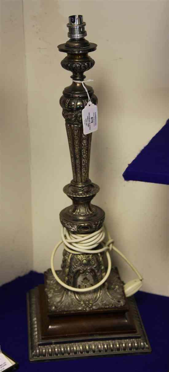 Appraisal: An ornate Victorian silver plated table lamp with turned waisted