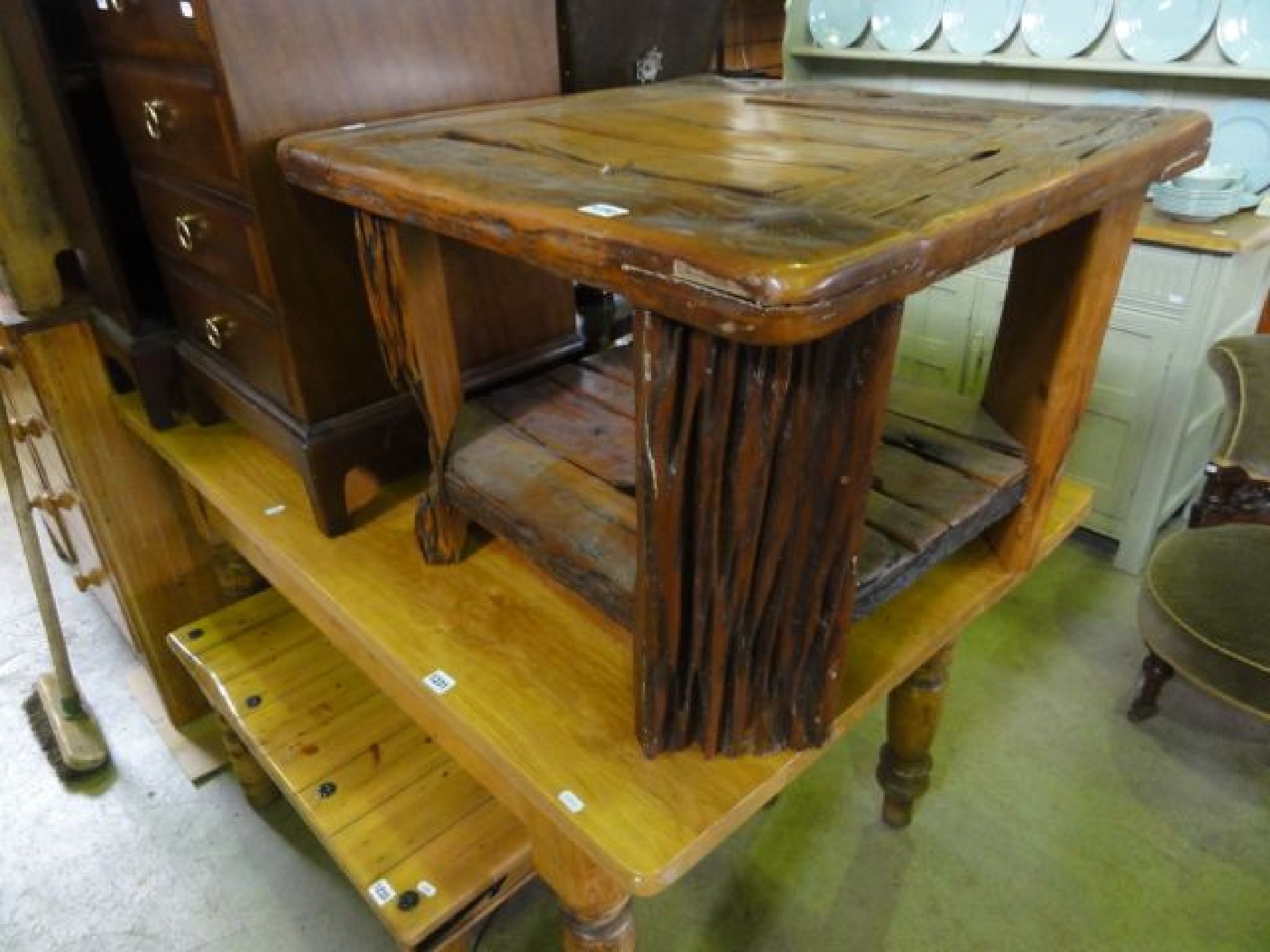 Appraisal: A rustic two tier hardwood occasional table with square top