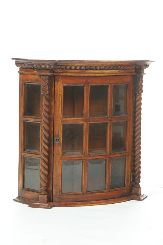 Appraisal: HANGING CUPBOARD Walnut bow front cabinet with nine pane glazed