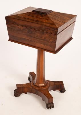 Appraisal: A Regency rosewood teapoy of sarcophagus shape fitted with four