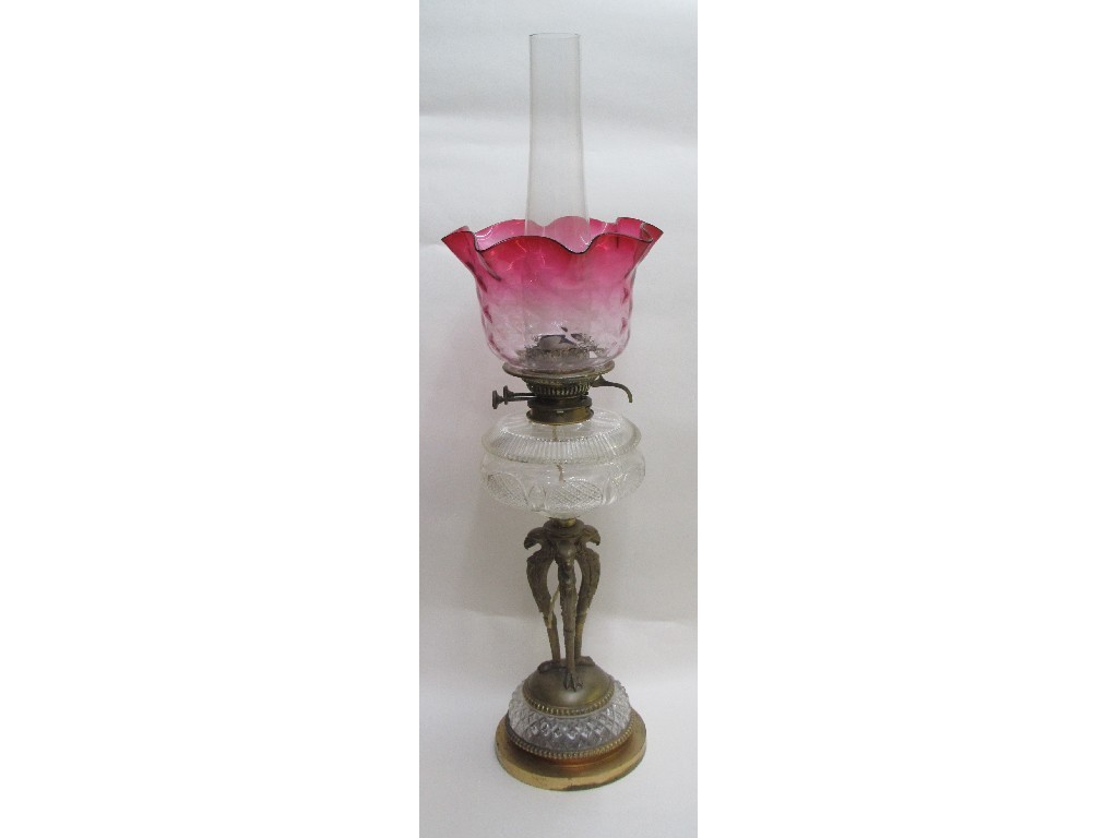 Appraisal: An Edwardian brass and cut glass oil lamp with pink