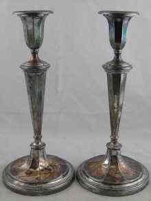 Appraisal: A pair of silver plated candlesticks by Mappin and Webb