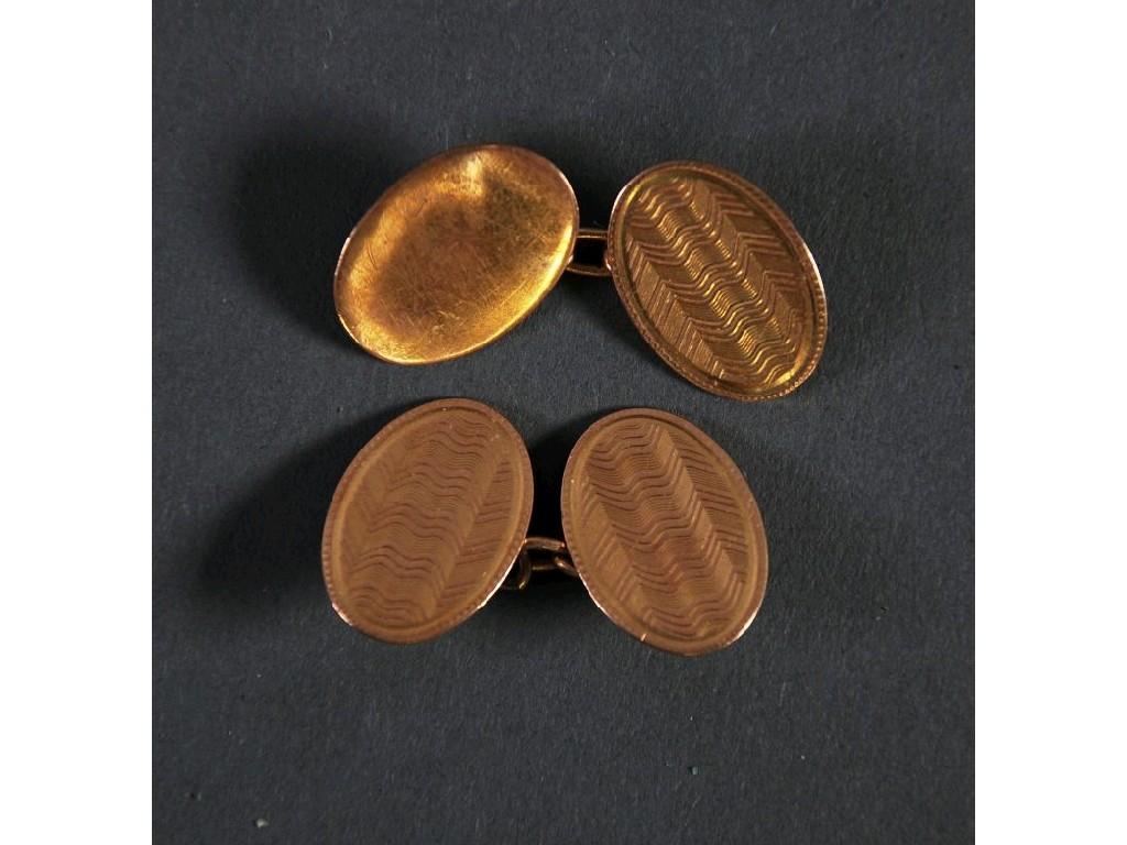 Appraisal: PAIR OF CT GOLD DOUBLE OVAL CUFF LINKS with engine