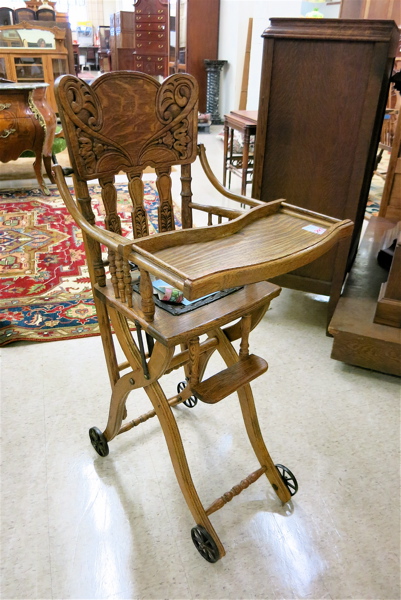 Appraisal: VICTORIAN PRESSED-BACK OAK HIGHCHAIR STROLLER American late th century the