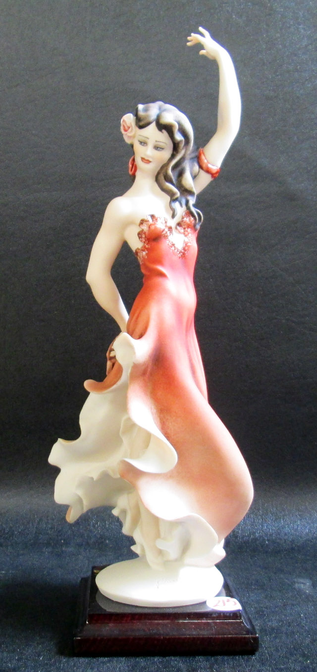 Appraisal: GIUSEPPI ARMANI FIGURAL SCULTURE Spanish Glamour C resin figure raised