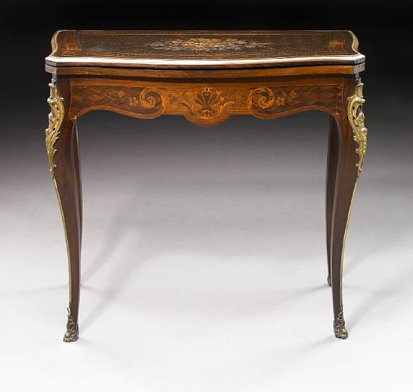 Appraisal: A Napoleon III gilt bronze mounted marquetry inlaid games table