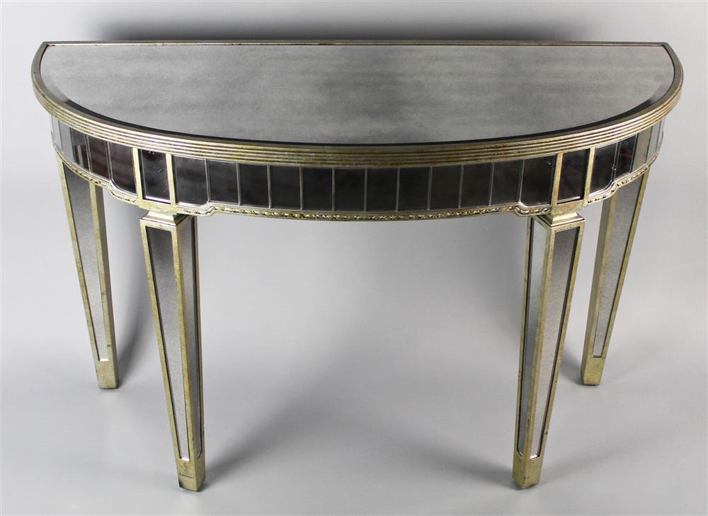 Appraisal: MIRRORED DEMILUNE CONSOLE TABLE the top with beveled glass over