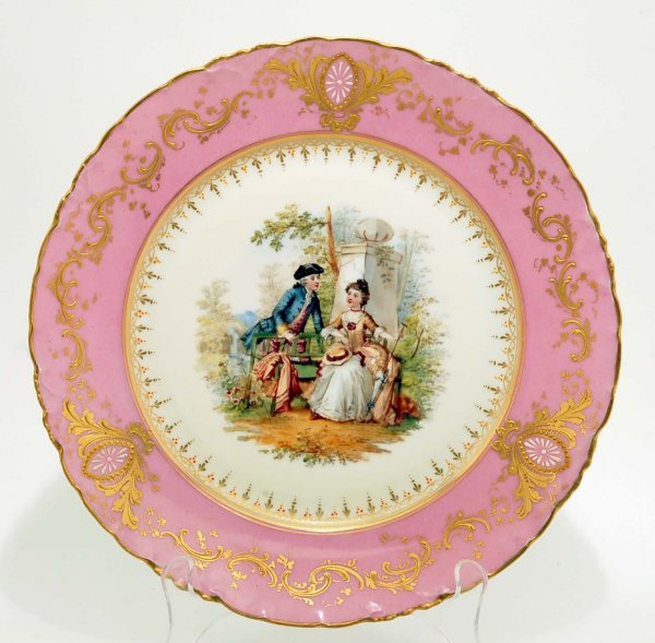 Appraisal: A Dresden porcelain plate Center Watteau style courting scene with