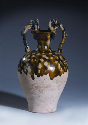 Appraisal: A Chinese pottery blue sancai splashed two-handled dragon amphora Tang