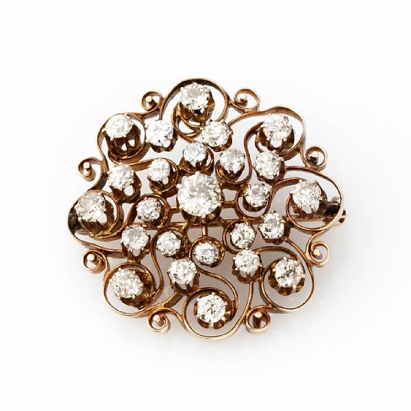 Appraisal: A diamond and k gold sunburst brooch converts to pendant