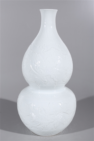 Appraisal: Large Chinese white glazed double gourd vase with floral designs