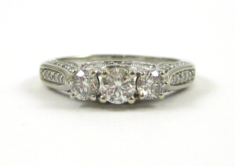 Appraisal: DIAMOND AND TEN KARAT WHITE GOLD RING with round-cut diamonds