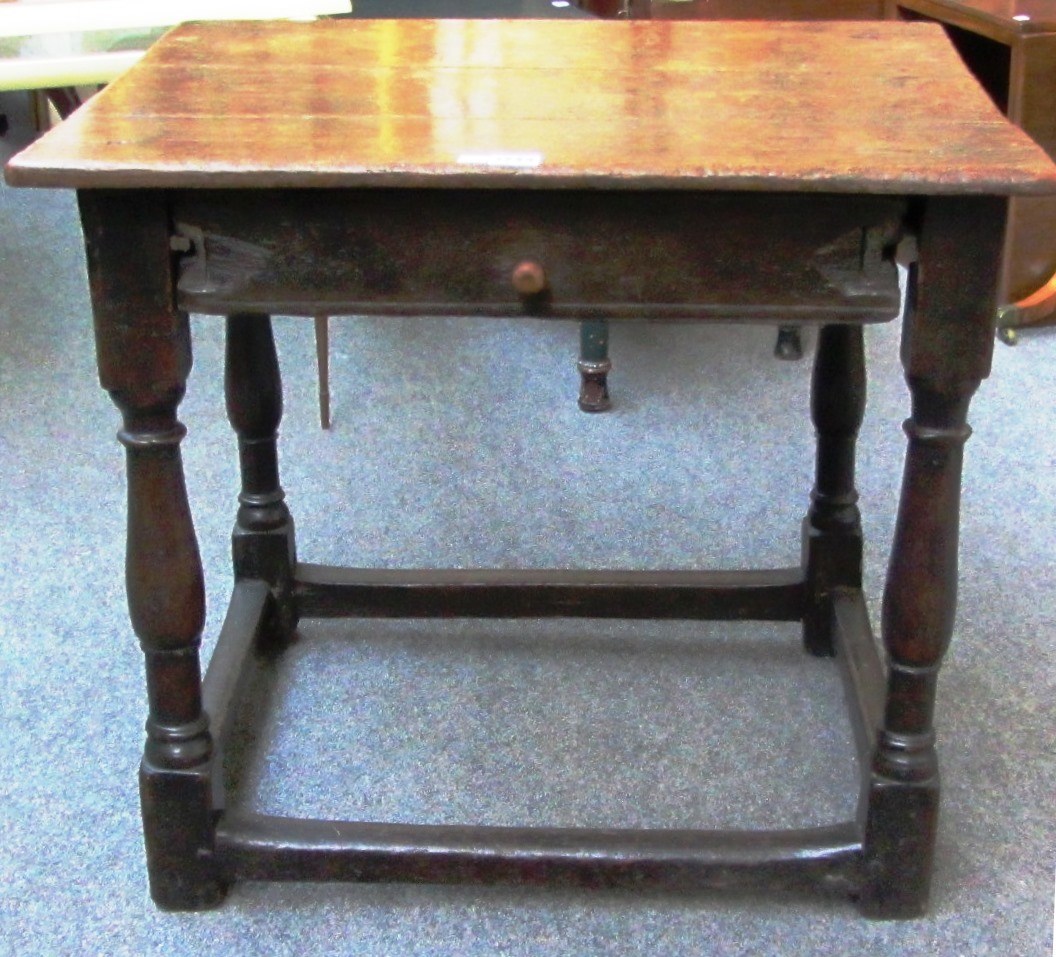 Appraisal: A th century oak single drawer side table on baluster