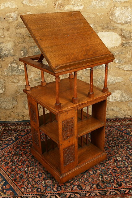 Appraisal: A LATE VICTORIAN OAK THREE TIER REVOLVING BOOKCASE with hinged