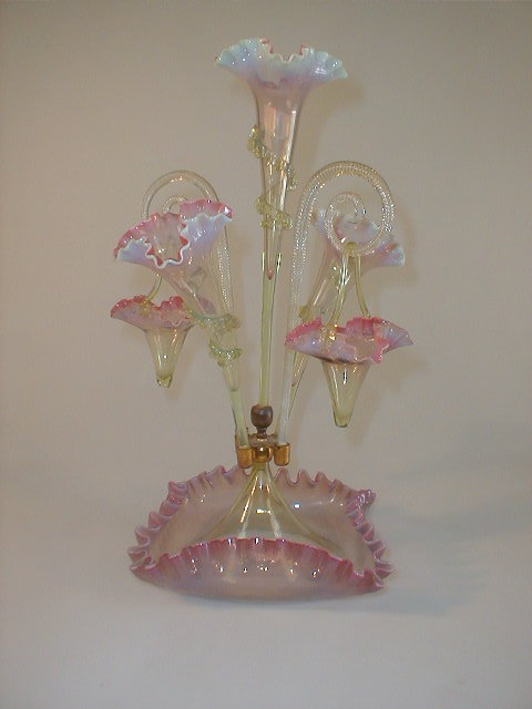 Appraisal: A Victorian vaseline glass table epergne composed of three trumpets