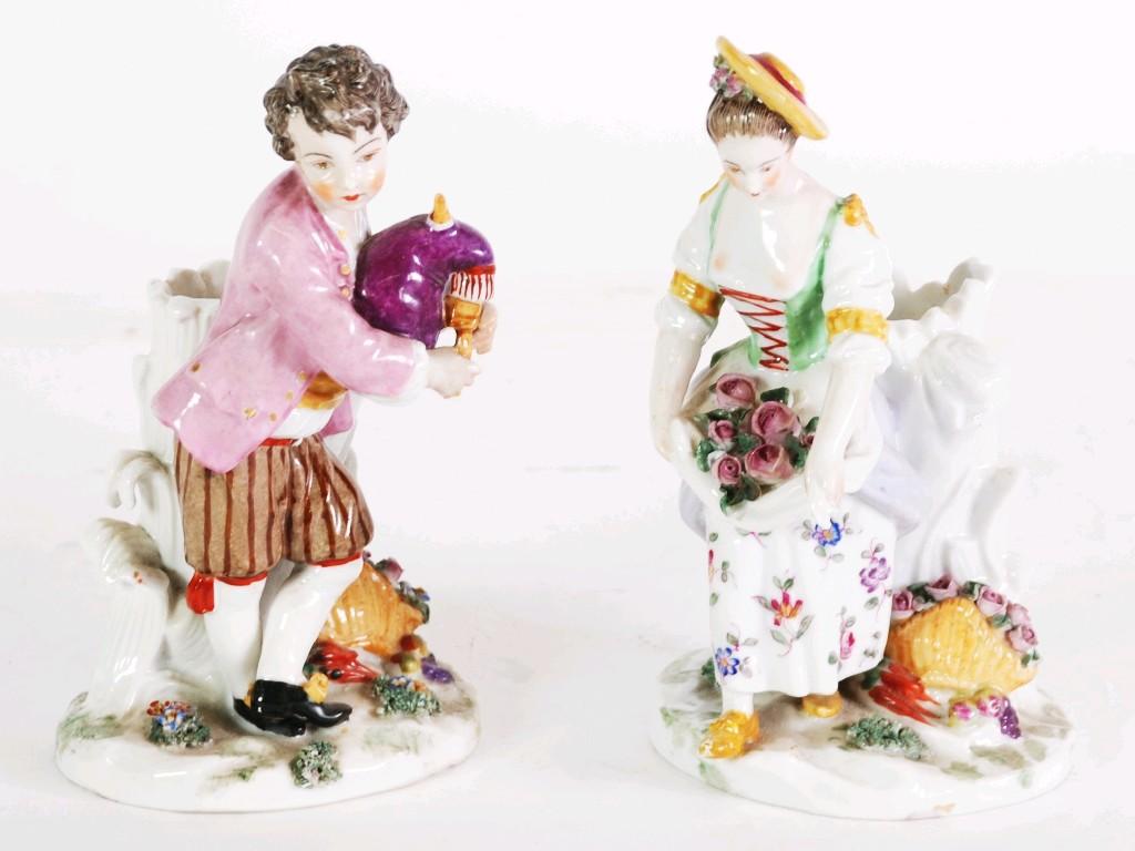 Appraisal: PAIR OF NINETEENTH CENTURY CONTINENTAL PRESS MOULDED PORCELAIN FIGURAL TAPER