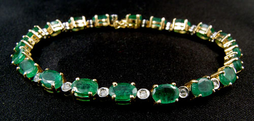 Appraisal: CTW EMERALD LINE TENNIS BRACELET K yellow gold bracelet contains