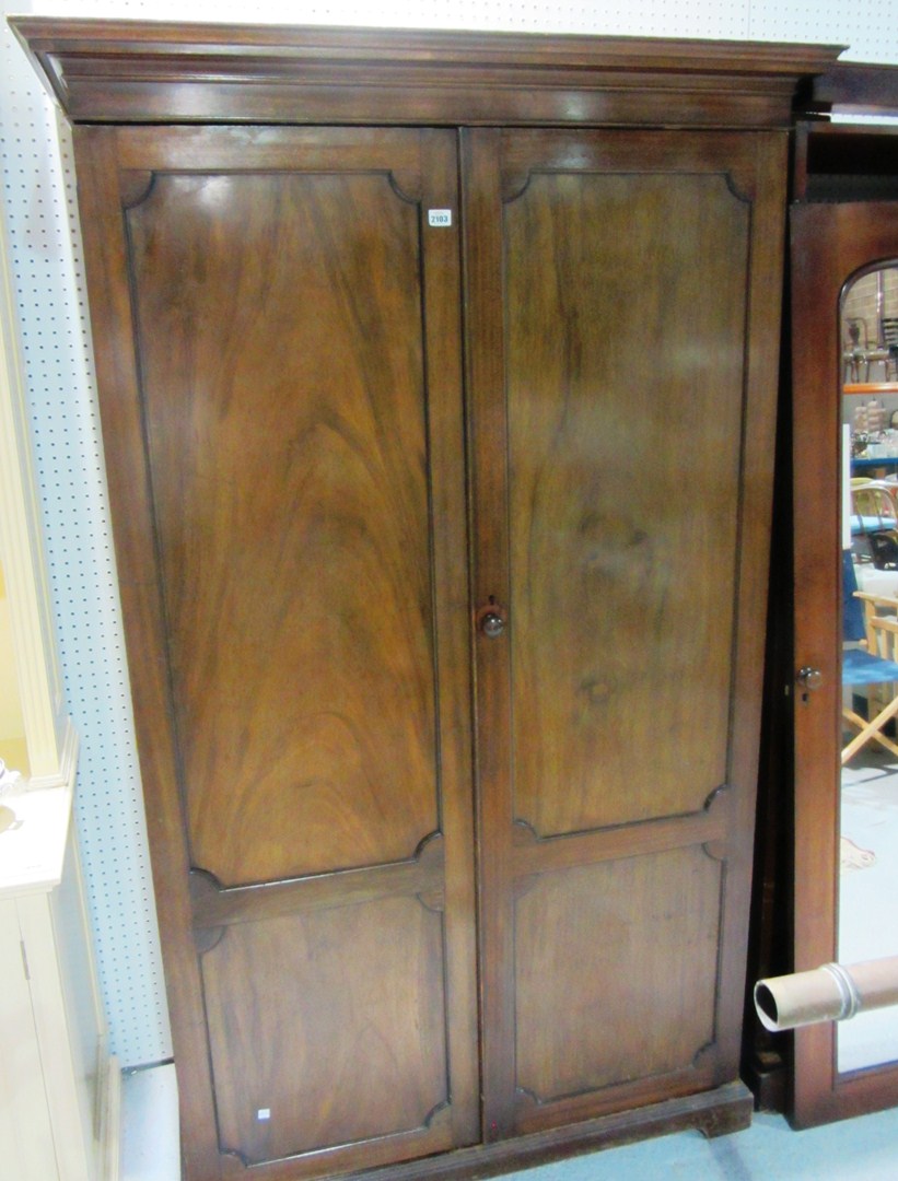 Appraisal: An early th century mahogany two door wardrobe