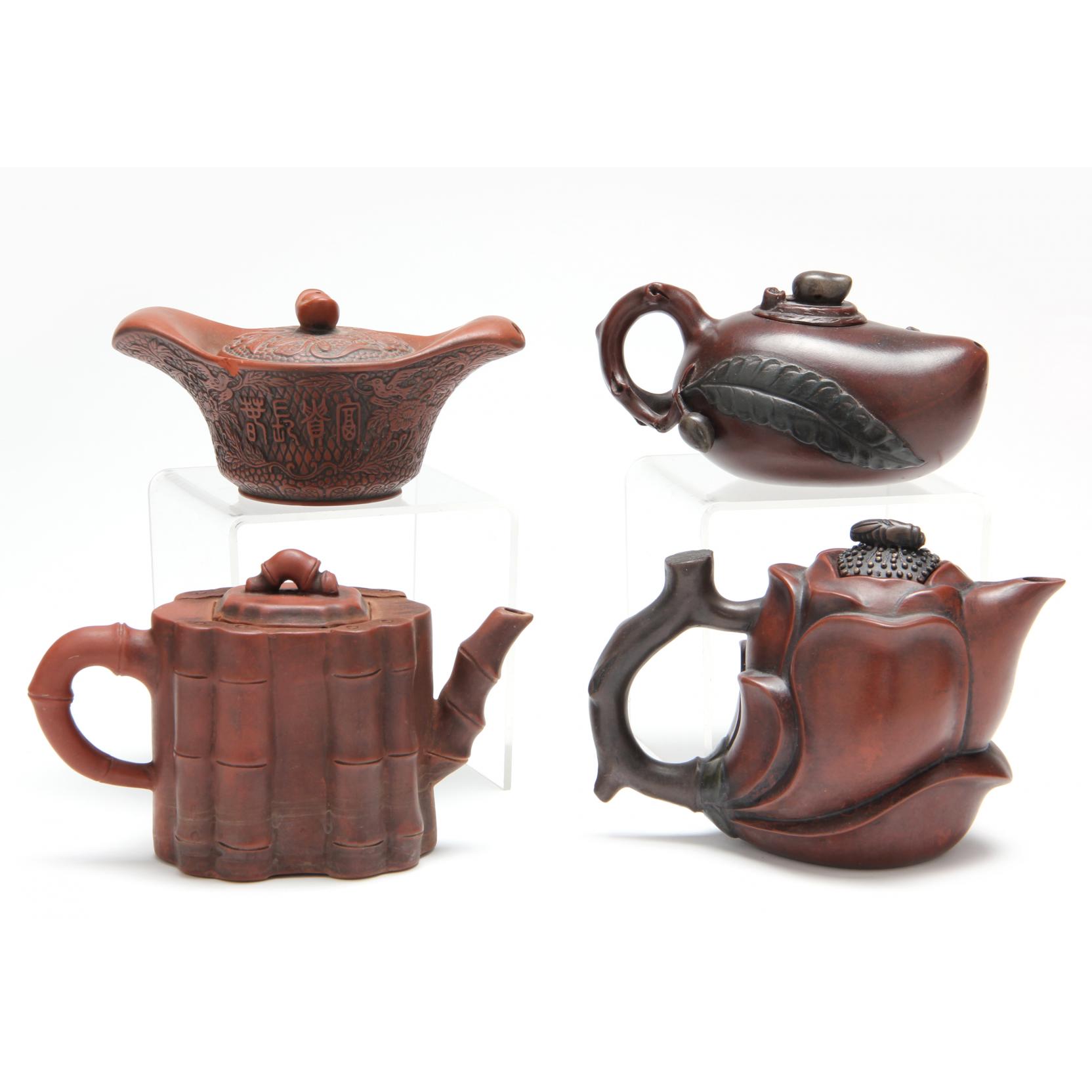 Appraisal: Group of Four Antique Yixing Teapots purple sand pottery all