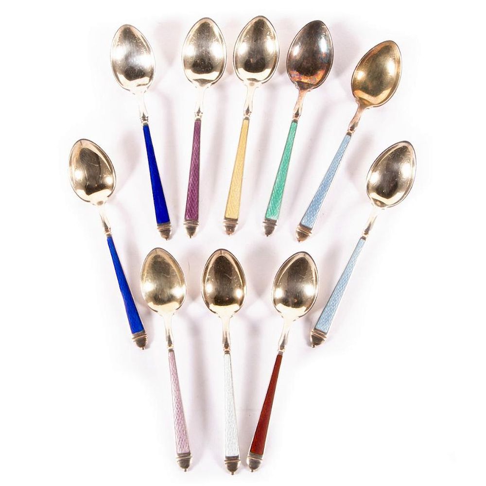 Appraisal: A set of sterling and enamel spoons A set of